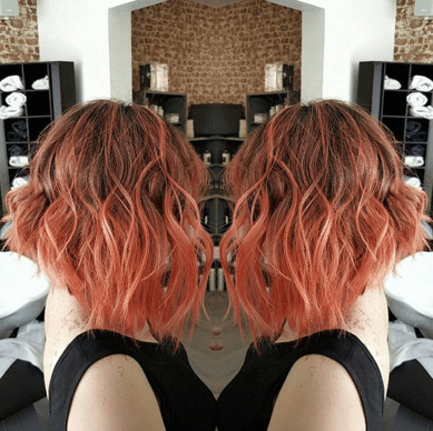 Peach to orange colored hair