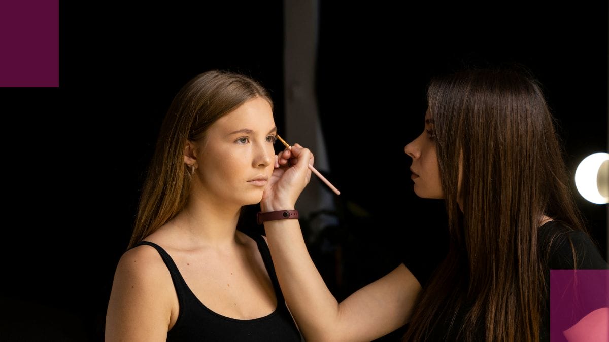 A beauty pro works diligently applying makeup to her client, one of her new creative services that's fun and meant to help her stave off beauty pro burnout.