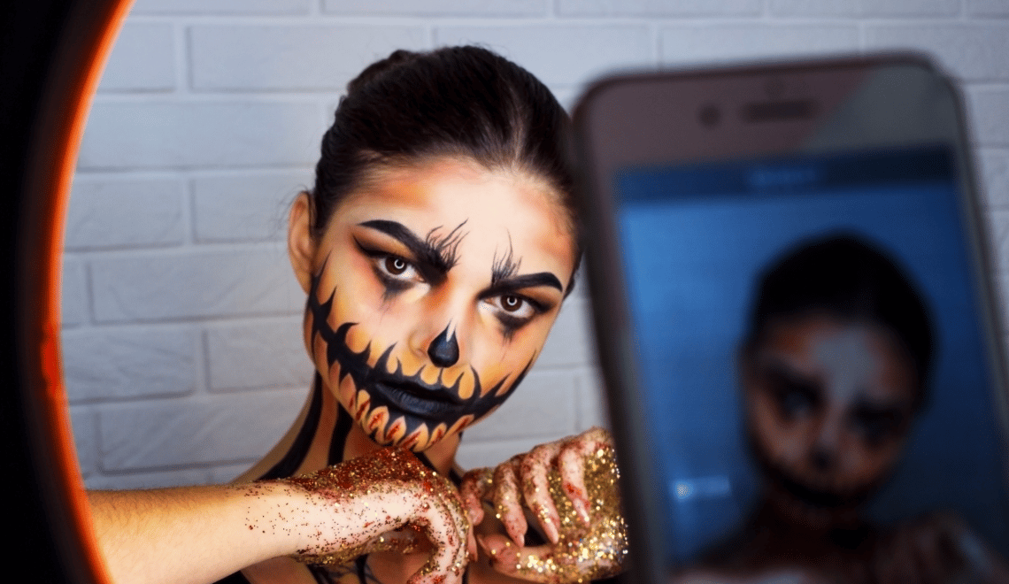 A client shows off her spooktastic look, a hot 2022 Halloween hair and makeup trend.