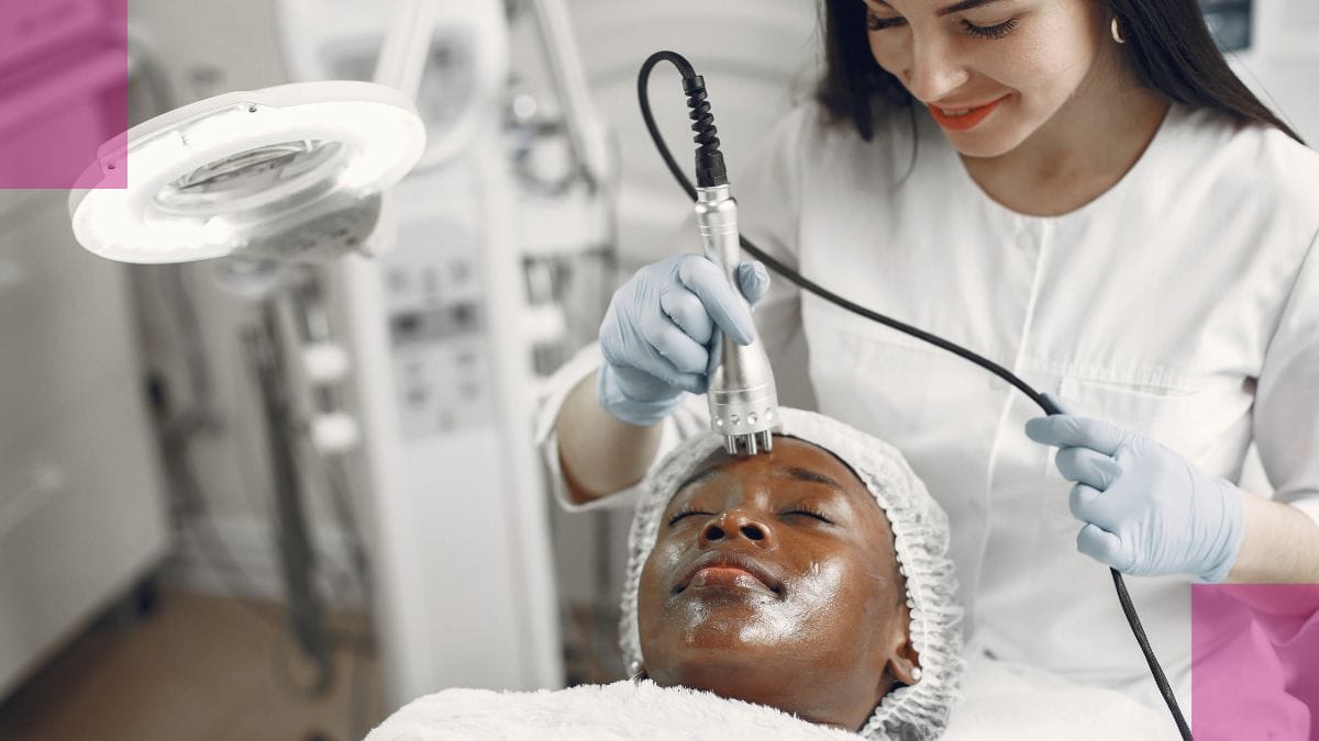 An esthetician does a skincare procedure on her client's face.