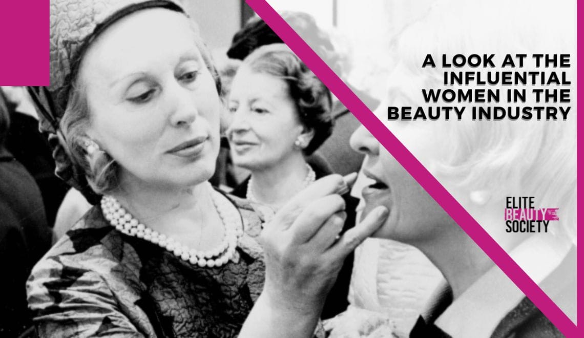 Two women in the beauty industry apply makeup to each other's faces.