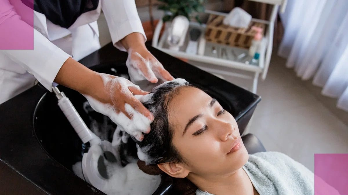 A woman gets her hair washed at her favorite AAPI shop during AAPI month.