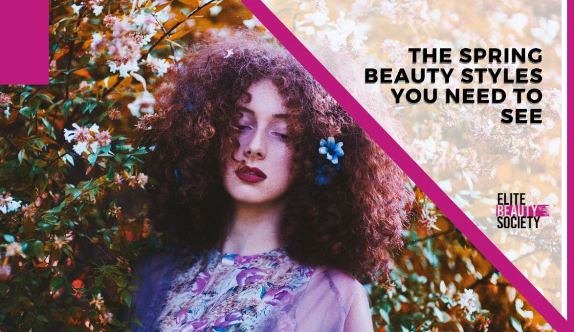 A stylist's client shows off her red hair and flower clips, spring beauty trends for the year.