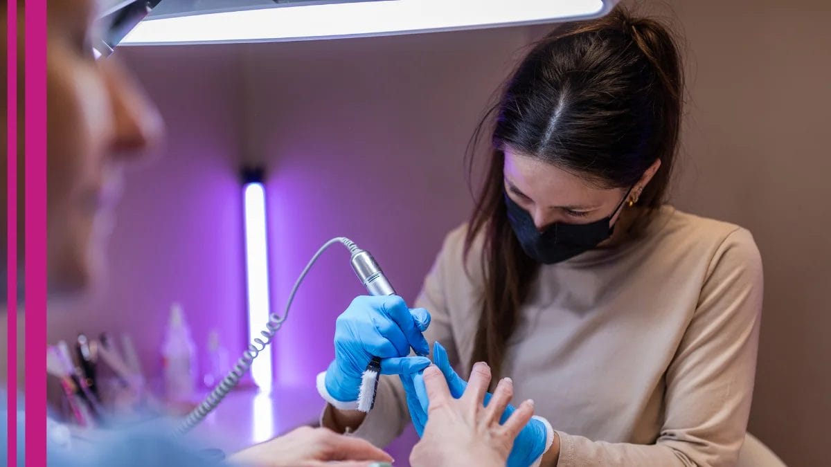 A client gets her nails done by the tech who talks about beauty pro licensing changes.