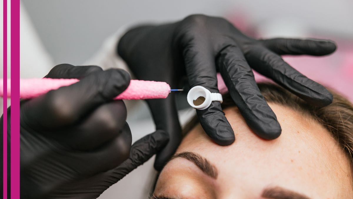 A microblading artist works on her client's brows in her studio.