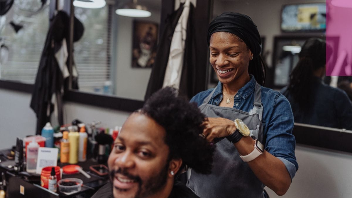A client and his hairstylist celebrate hairstylist appreciation month.