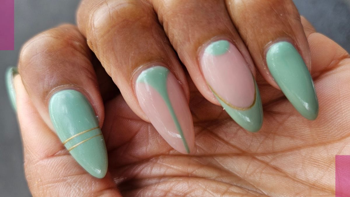 A client shows off her nails, done by her nail technician in the middle of her nail tech program.