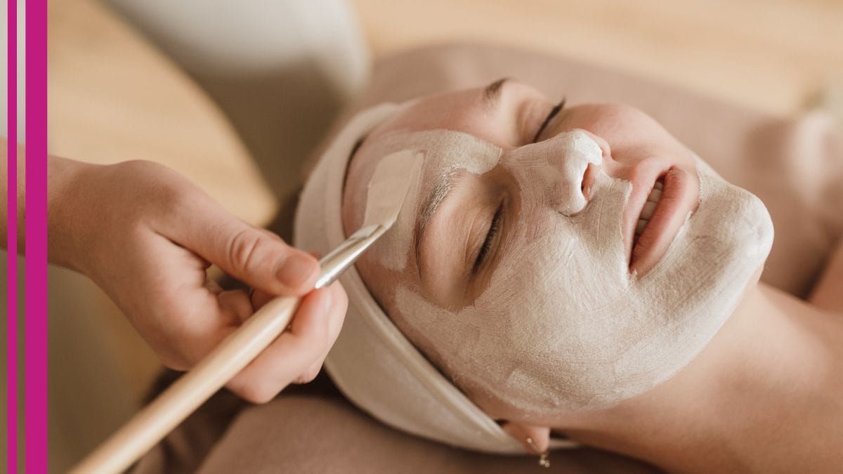 What does a holistic health practitioner do? A beauty pro shows her client while layering on a face mask.