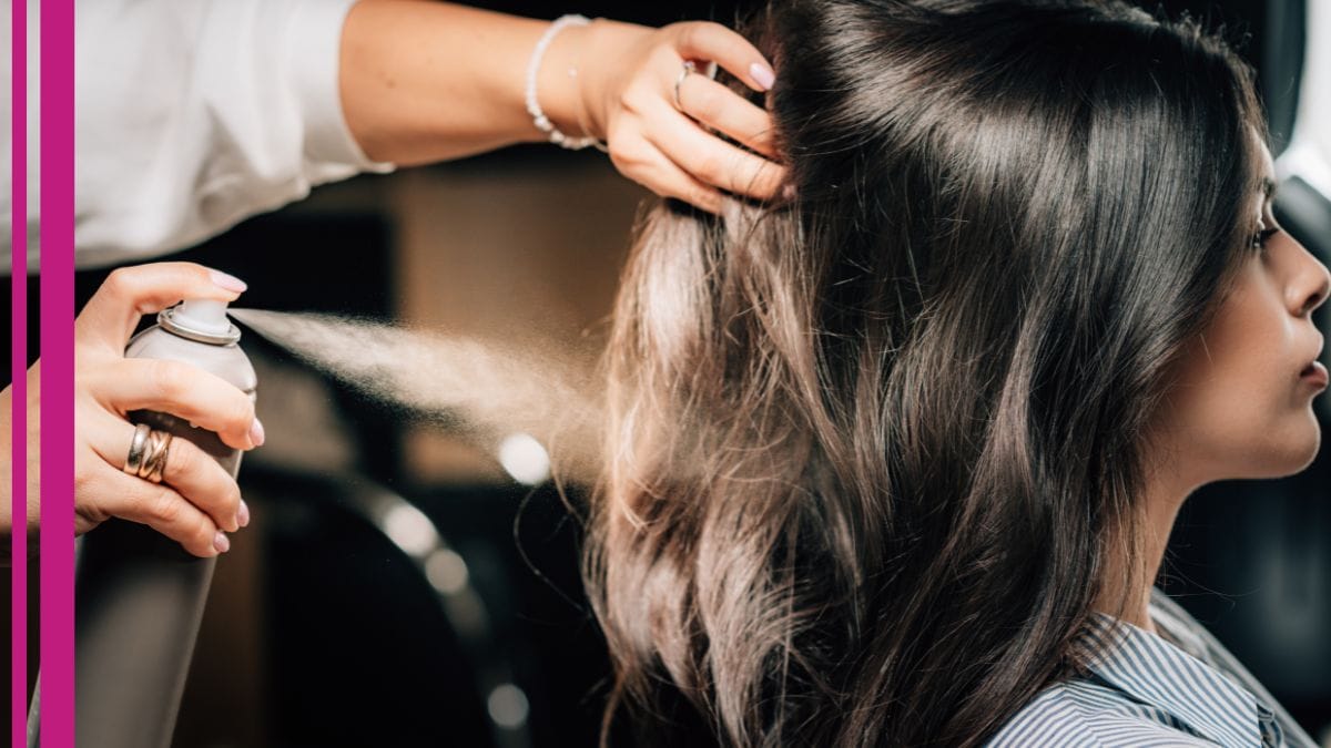 A stylist uses a special spray to help heal her client's scalp – a step in her how to take care of your scalp treatment plan.
