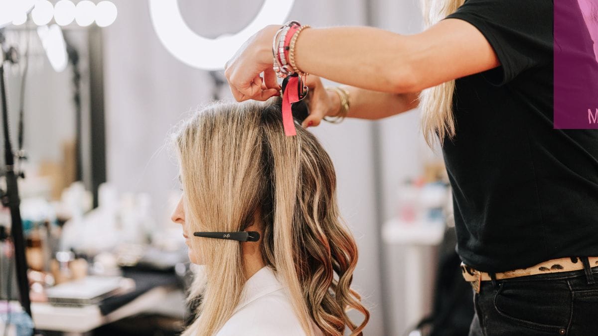 A client gets her hair colored and asks if hair loss is a sign of menopause.