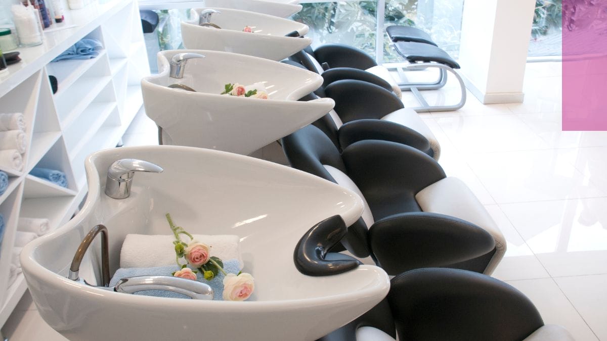 A small shampoo section is shown at a salon that a client is attending after googling seo tips for small businesses.