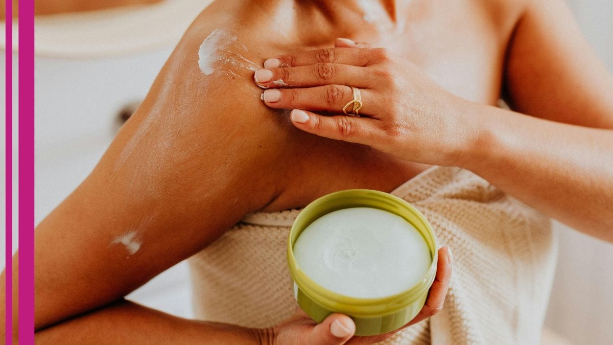 A client rubs lotion on their skin as part of their best skincare for aging skin and wrinkles routine.
