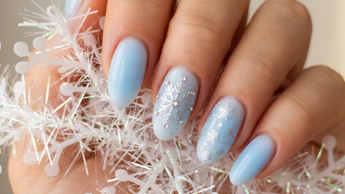 winter-themed holiday nails with snow design