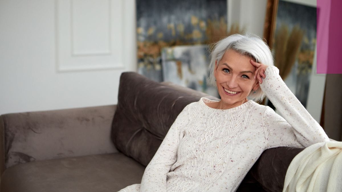 A woman poses for a photo with her new going gray look.