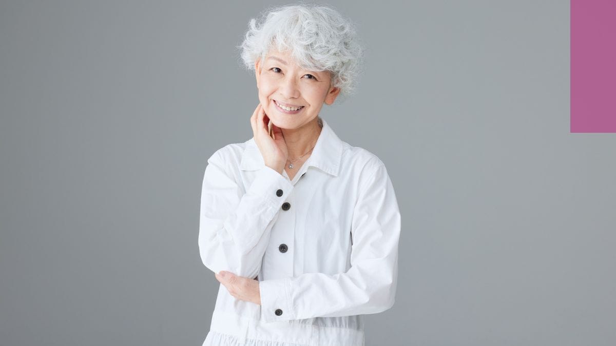 A woman shows off her stylish new going gray look.