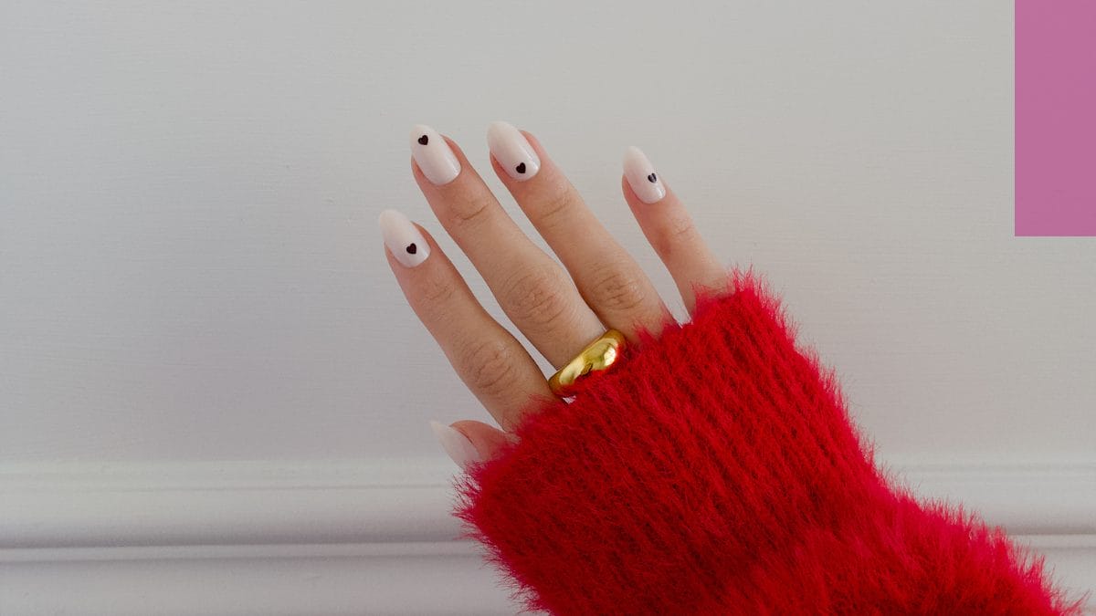 seasonal coquette black and white heart nail design