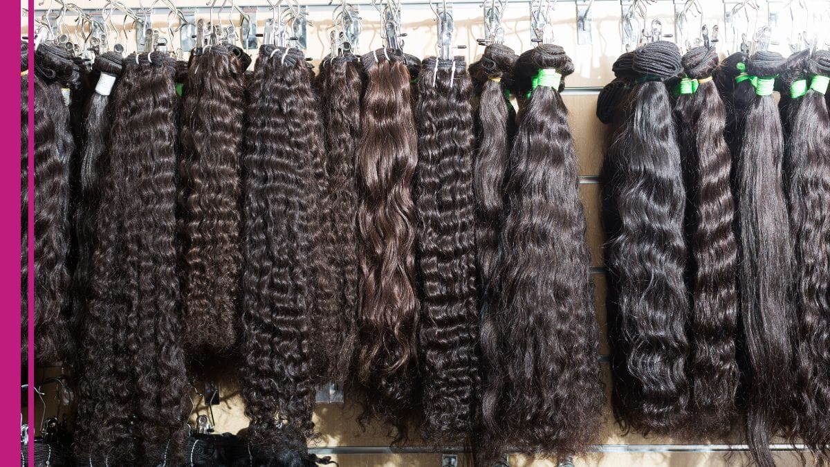 A long row of hair extensions are shown at a hair extensions courses and education seminar.