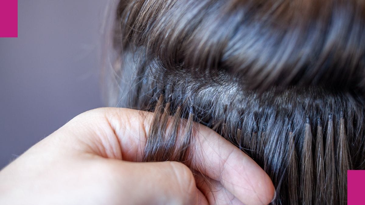 A beauty pro shows off her hair extension work during her hair extension courses.