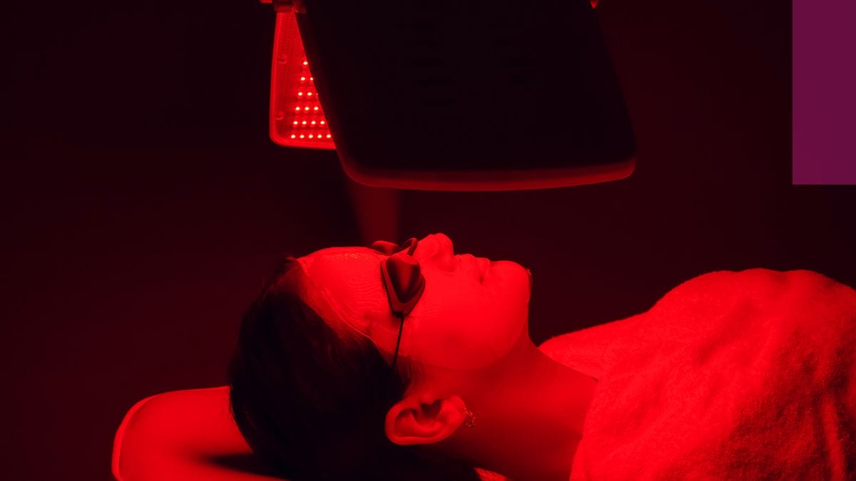 Despite the red light therapy risks, a client gets her red light treatment done.