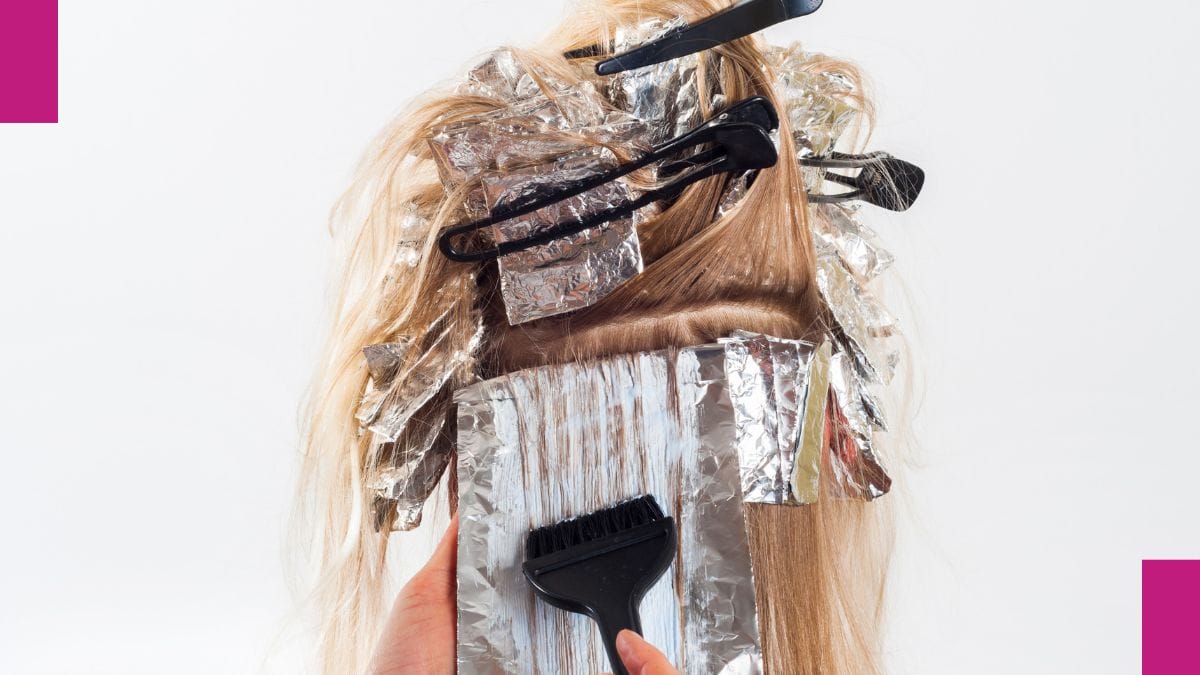 A stylist shows off her skill correcting color, explaining why she has her hair color correction pricing the rate it is.