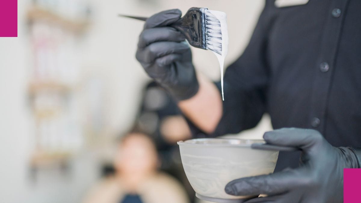 A client mixes up a special formula to correct her client's hair color