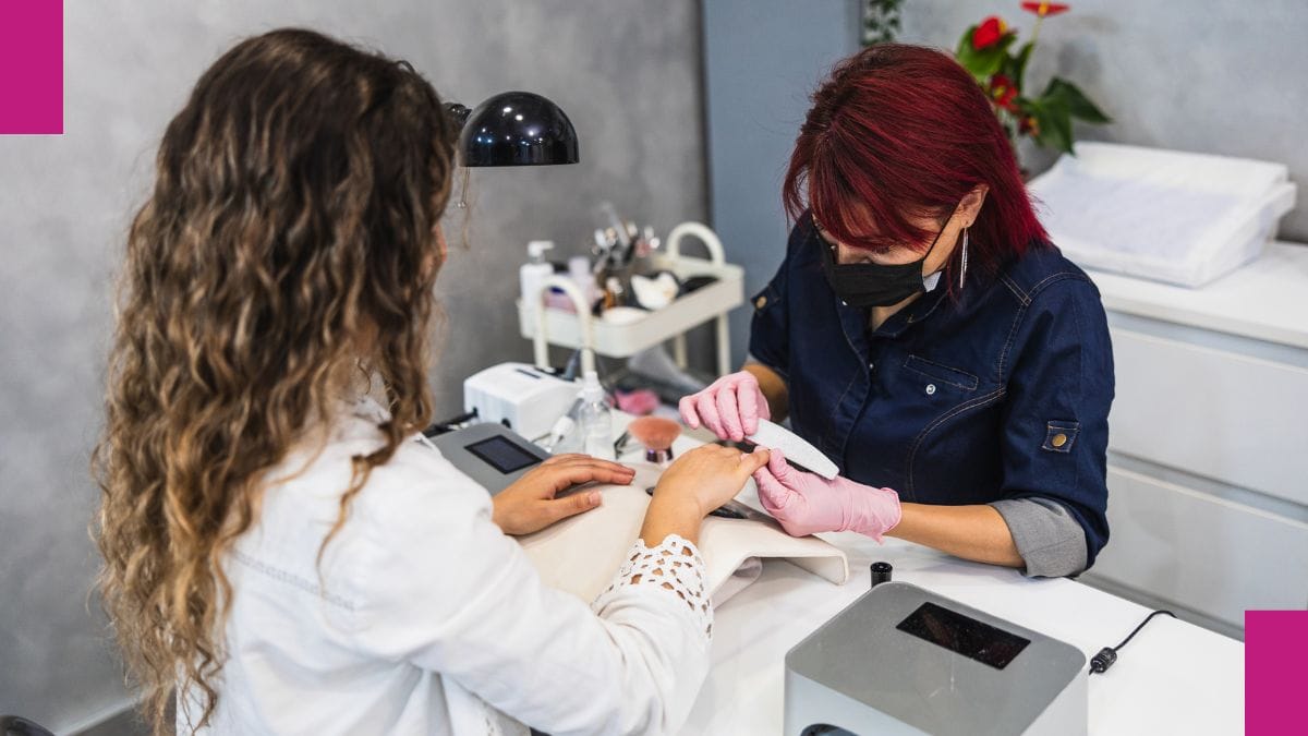 A client gets her nails done by a beauty pro who's contemplating how to handle a bad review.