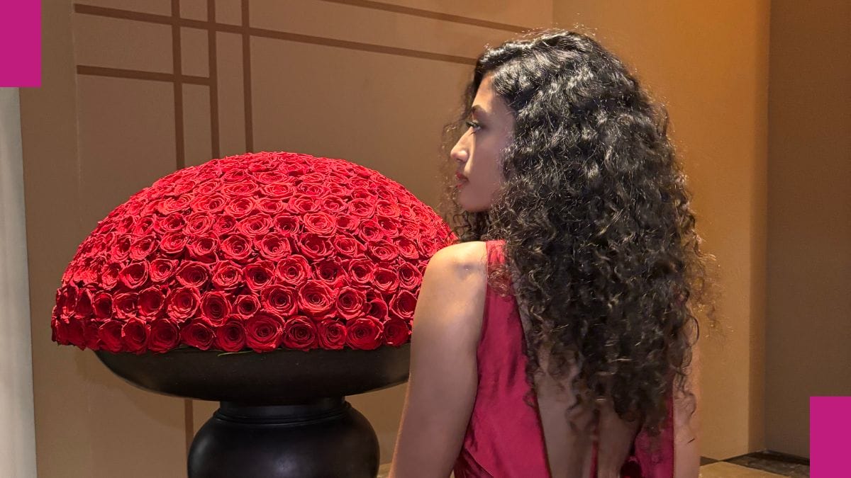 A stylist helped her client with her natural curls after showing her how to refresh low porosity curly hair.