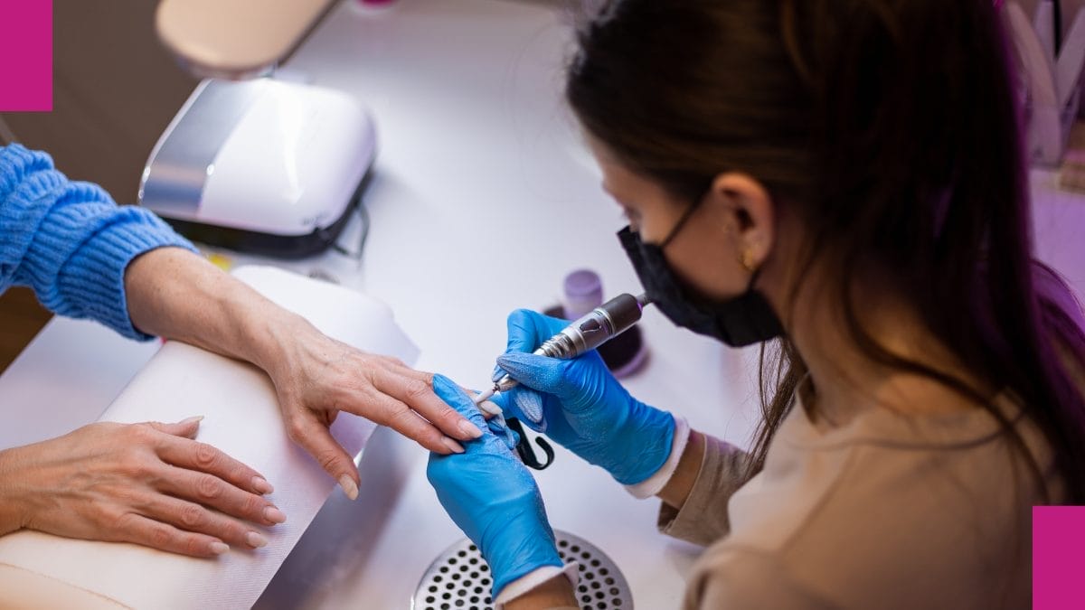 A client gets her nails shaped and avoids getting cut at the nail salon.