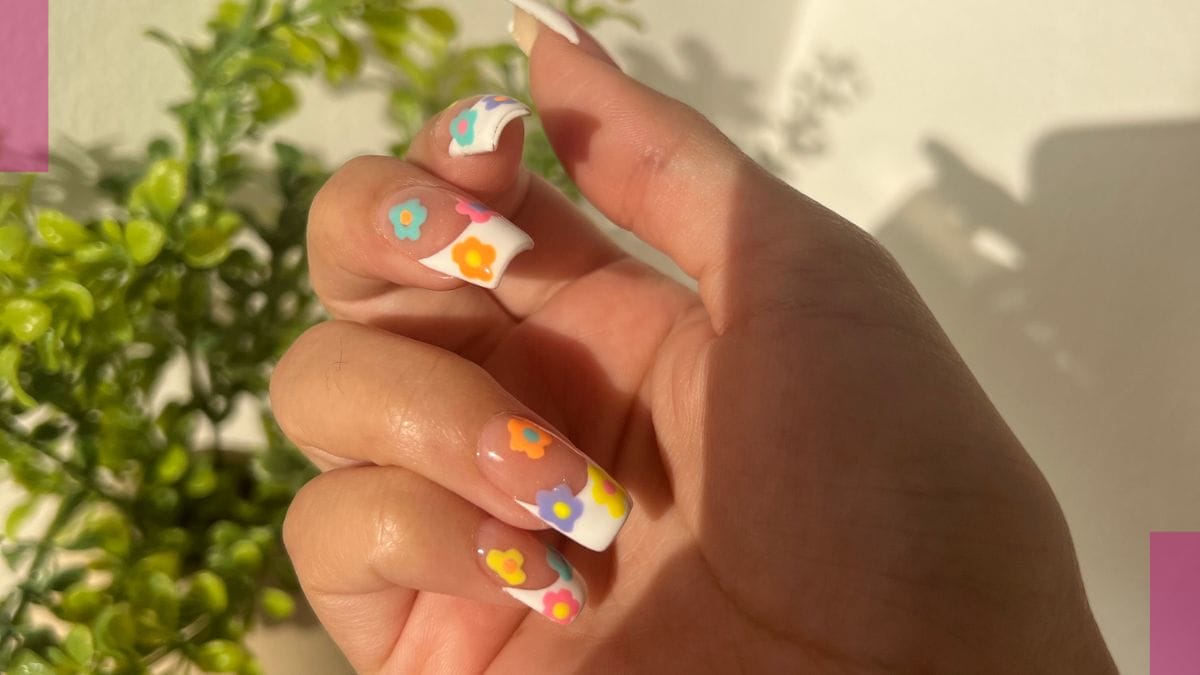 Flower nails – one of the summer beauty trends - are shown off by a client.